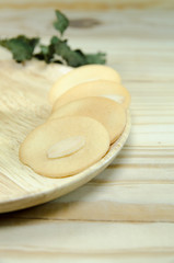 almond cookie on wooden table