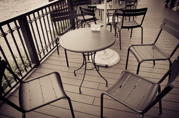 vintage tone process font of coffee shop and group of chair