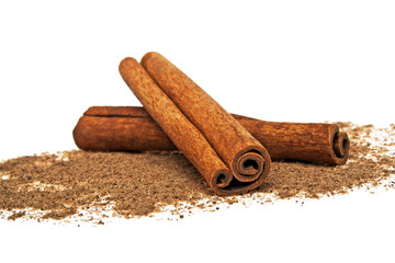 Cinnamon sticks and powder on white background