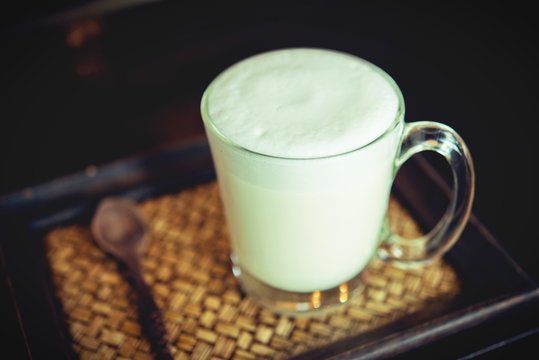 Hot milk in a glass on  wooden Backgrounds