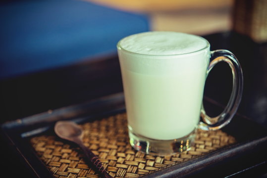 Hot milk in a glass on  wooden Backgrounds