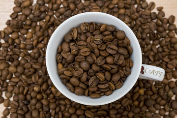 Coffee cup and coffee beans. Close up