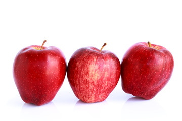 Fresh three red apples isolated on white background.