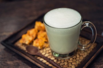 Hot milk in a glass on  wooden Backgrounds