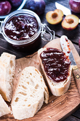 Homemade plum jam with fresh bread