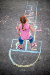 beautiful litlle girl on the hopscotch