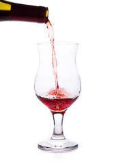 Clear glass and a bottle of red wine