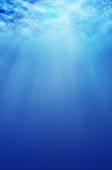 underwater background with sand and sunlight