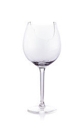 Broken glas of wine isolated on white 