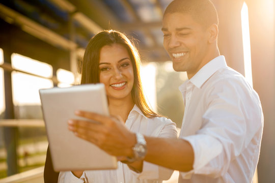  Business people discussing a project on a digital tablet