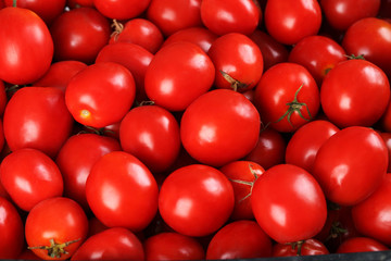 Fresh red tomatoes background, close up