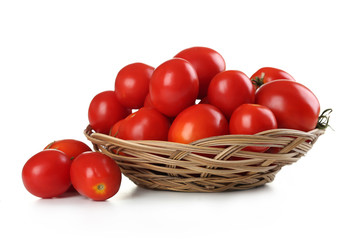 Fresh red tomatoes in basket isolated on white