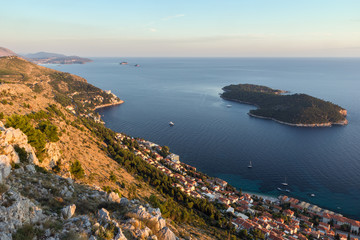 Fototapeta na wymiar Scenic view of coastline and Lokrum Island from the Mount Srd in Dubrovnik, Croatia at sunset.