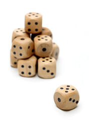 Wooden Dice on a White Background
