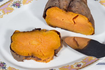 Roasted sweet potato in white ceramic tray