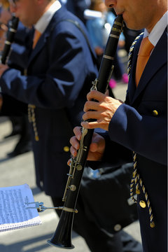 musician playing a clarinet during the patron feast.
Selective focus.