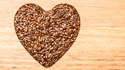 Raw flax seeds linseed heart shaped