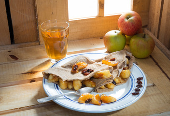 pancakes with apple and a glass of cider