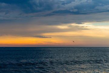 beautiful landscape with sunset over sea with dramatic sky