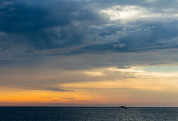 beautiful landscape with sunset over sea with dramatic sky