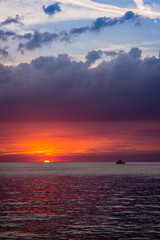 beautiful landscape with sunset over sea with dramatic sky