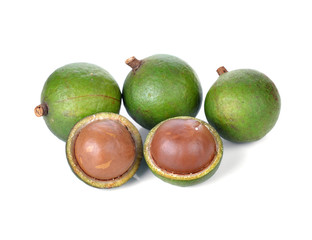 Fresh macadamia nuts on white background