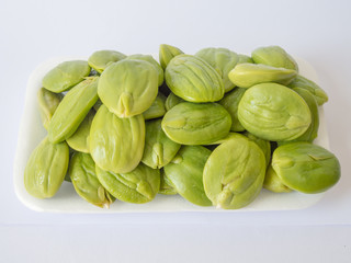 Thai green Parkia on white background.Have a pungent smell.Popularity led to to cook puff in Thailand.