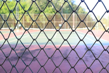 Fototapeta premium Tennis Court behind the fence