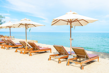 Umbrella and chair on beautiful tropical beach