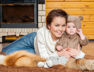 Mother and baby playing and smiling. Happy family.Home interior.