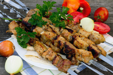 Pork to find Fresh vegetables on a dark gray background