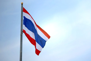 The flag of Thailand on the blue sky.