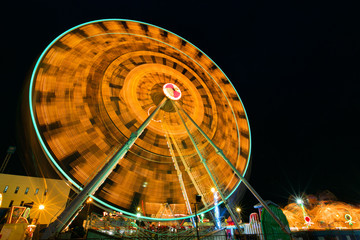 Ferris wheel with outdoor long exposure at night.