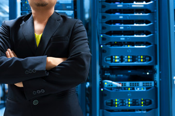Fototapeta premium Man fix server network in data center room