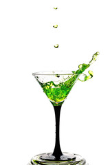 Cocktail glass with splash isolated on white background.
