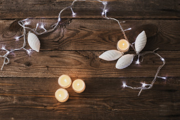 Christmas lights on a wooden background with copy space