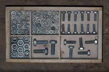 screws and bolts in a box
