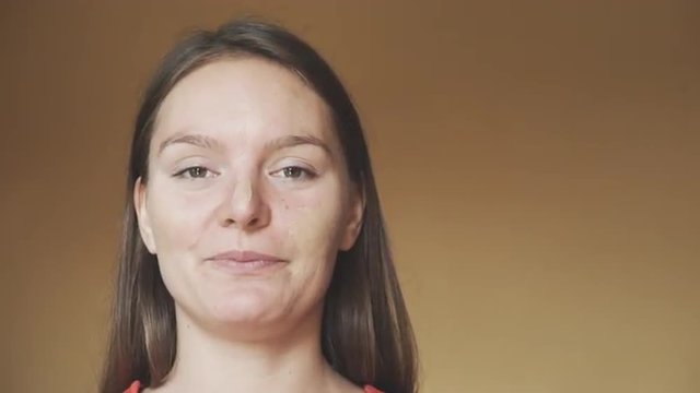 Girl with makeup powder strokes making silly face