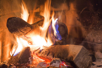 Firewood burning in fireplace