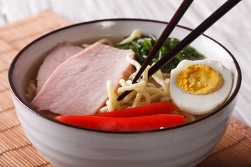 Japanese ramen noodles with pork and egg close up. Horizontal
