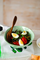 Salad from green beans with olives and egg