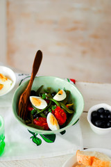 Salad from green beans with olives and egg
