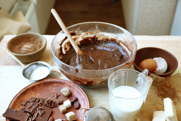 Preparing dough for chocolate pie on table close up