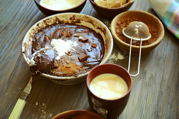 Preparing dough for chocolate pie on table close up
