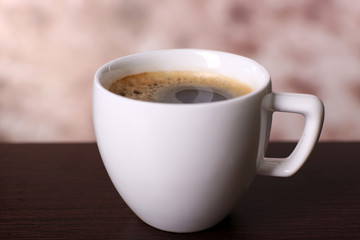 Cup of coffee on table close up
