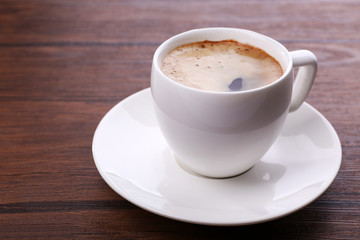 Fototapeta premium Cup of coffee on table close up