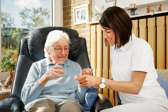 Nurse caring for elderly person