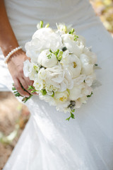 bride with wedding bouquet peony flowers