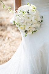 bride with wedding bouquet peony flowers