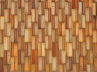 Orange rectangular tiles cladding background.